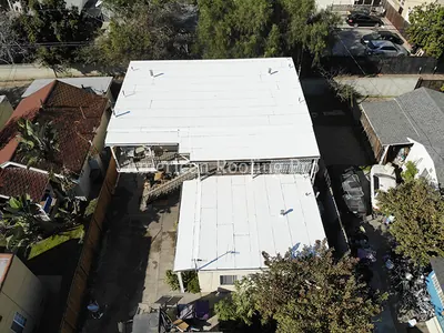 Drone shot of a finished single family home roof.