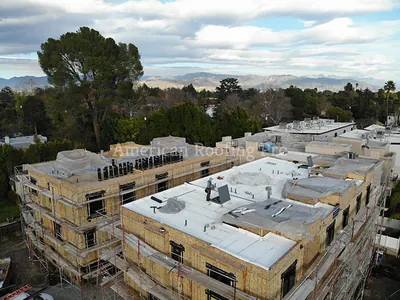 Active roofing work on a residential property.